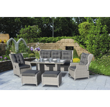 Ensemble de meubles de jardin avec table, canapé, fauteuils et tabourets sur une terrasse