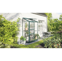 Serre avec étagères pour plantes sur un mur de maison dans le jardin