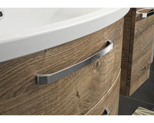 Detailansicht eines Waschtischunterschranks mit Holzstruktur und Handtuchhalter