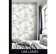 Chambre à coucher avec papier peint à motif de feuilles