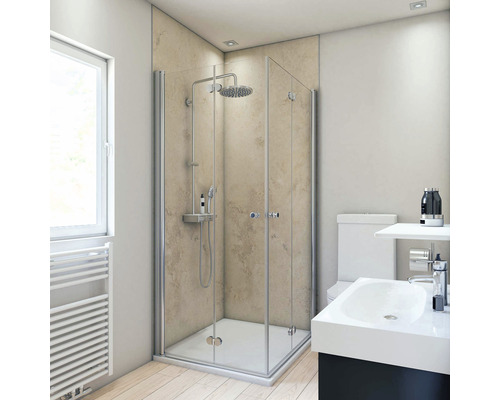 Salle de bain lumineuse avec cabine de douche, lavabo et toilettes