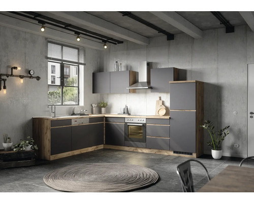 Cuisine moderne en gris et aspect bois avec appareils électriques et décorations dans une pièce aux murs en béton
