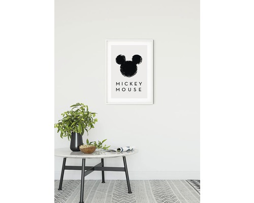 Image décorative avec la silhouette de Mickey Mouse dans un cadre sur un mur