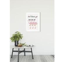 Image décorative avec des flamants roses dans un cadre au-dessus d''une table