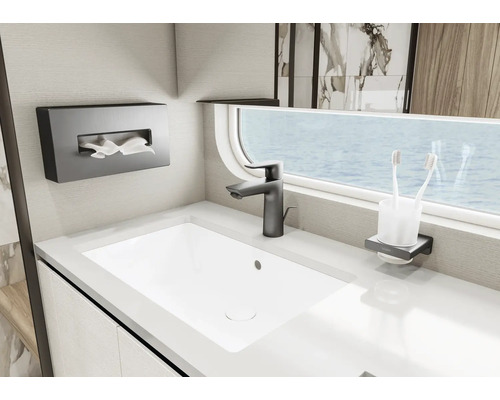 Modernes Badezimmer mit Waschbecken, Armatur, Taschentuchbox und Zahnputzbecherhalter