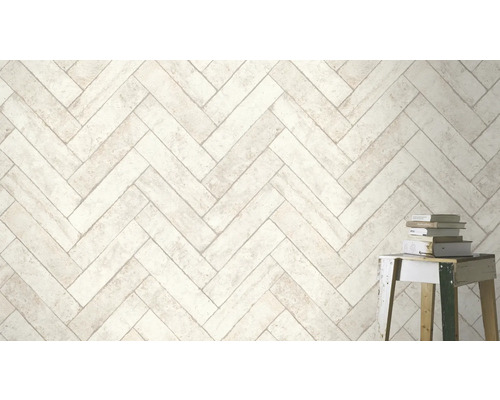 Carrelage mural clair à motif de chevrons