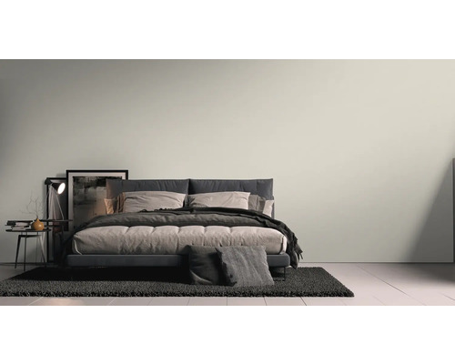 Chambre à coucher avec lit, table de chevet, lampe et tapis pour une atmosphère calme et relaxante