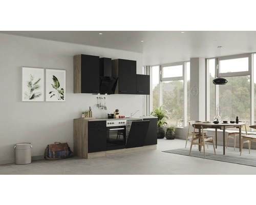 Moderne Küche mit schwarzen Schränken, Esstisch und Stühlen in einem hellen Raum.