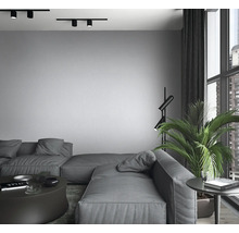 Wohnzimmer mit modularem Sofa, Stehlampe und Schienenstrahler