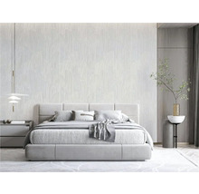 Chambre avec lit et papier peint à motifs pour une atmosphère paisible