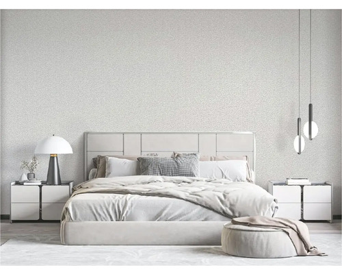 Chambre lumineuse avec lit, tables de chevet, lampe et suspensions