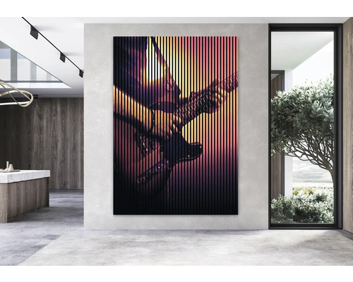 Grosses Wandbild mit dem Motiv eines Gitarristen in einem modern eingerichteten Raum