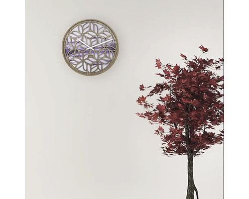 Horloge murale décorative avec motif géométrique et mouvement à quartz sur un mur.