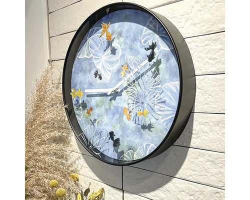 Horloge murale avec motifs de poissons et cadre noir
