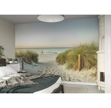 Schlafzimmer mit Fototapete eines Sandstrandes