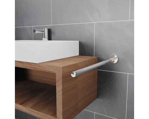 Lavabo de salle de bain avec porte-serviettes mural