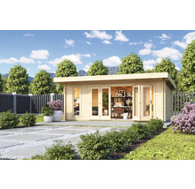 Maison de jardin moderne avec toit plat et mobilier de bureau dans le jardin