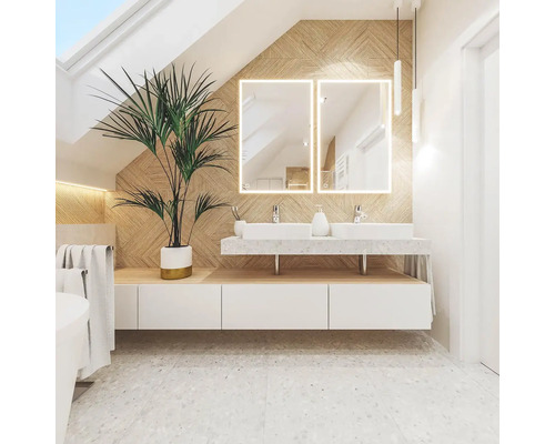 Salle de bains lumineuse avec double vasque, miroirs éclairés et plante d''intérieur pour une atmosphère conviviale.