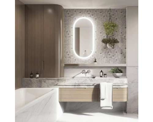 Salle de bains moderne avec lavabo, miroir lumineux, robinetterie et étagère