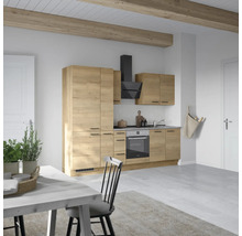 Cuisine claire avec aspect bois, hotte aspirante et table à manger