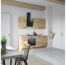 Cuisine claire avec aspect bois, hotte aspirante et table à manger
