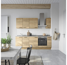 Cuisine claire avec aspect bois, hotte aspirante et table à manger