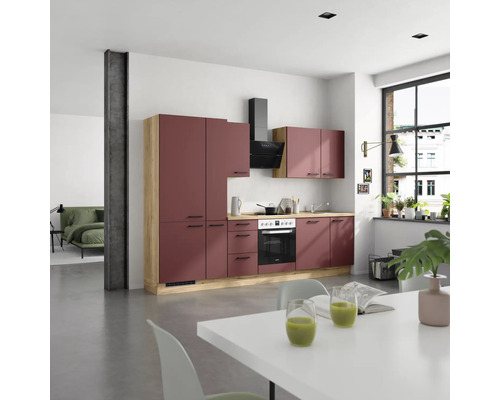 Cuisine moderne avec armoires de cuisine, hotte aspirante et cuisinière électrique dans une pièce lumineuse