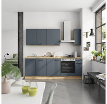 Cuisine moderne avec armoires bleues, hotte et évier