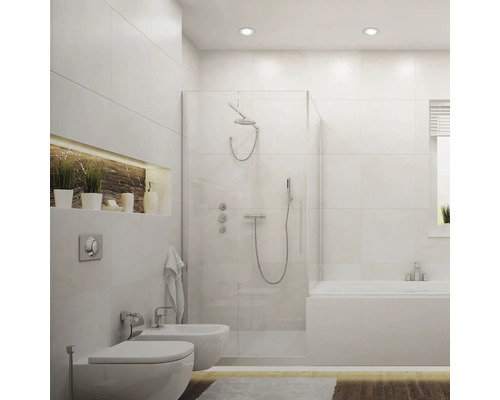 Salle de bains lumineuse avec douche, baignoire, toilettes et bidet au design blanc