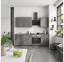 Moderne Küche mit grauen Schränken und schwarzer Dunstabzugshaube in einer hellen Wohnung.