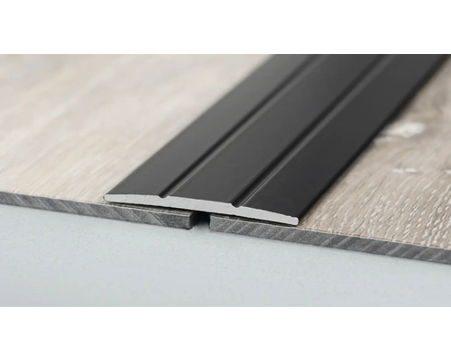 Profilé de revêtement de sol pour raccorder deux revêtements de sol