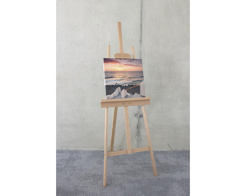 Staffelei mit Leinwandbild einer Meereslandschaft