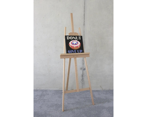 Staffelei mit einem Bild von einem Donut mit dem Text ''Donut Give Up''