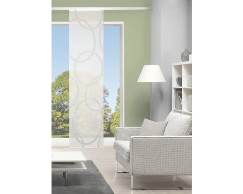 Salon avec panneau coulissant à motif de cercles devant la fenêtre