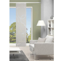 Salon avec rideau coulissant à motif de cercles, canapé et bibliothèque