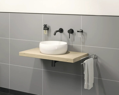 Salle de bains moderne avec vasque à poser, robinet, distributeur de savon et porte-serviettes