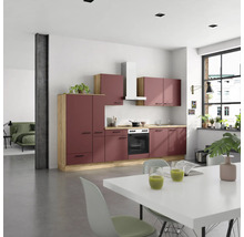 Cuisine lumineuse avec kitchenette, armoires suspendues, hotte aspirante et table à manger dans une ambiance moderne.