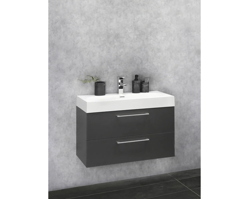 Meuble-lavabo avec deux tiroirs et robinet dans la salle de bain