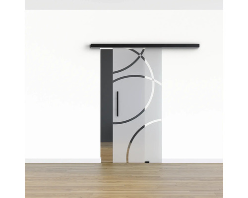 Schiebetür aus Glas mit Kreismuster in einem hellen Raum