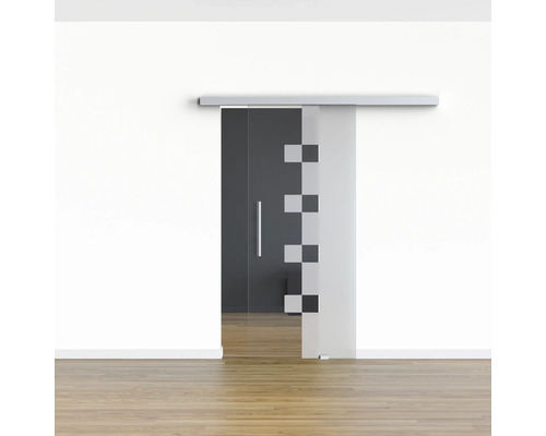 Porte coulissante en verre avec motif géométrique devant un mur blanc