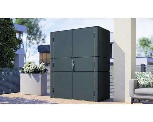 Armoire de jardin en métal sur une terrasse avec des plantes