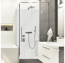 Salle de bain moderne avec douche, lavabo et carrelage blanc à chevrons