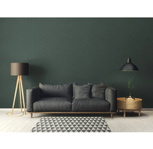 Wohnzimmer mit grauem Sofa, Stehlampe und Pendelleuchte
