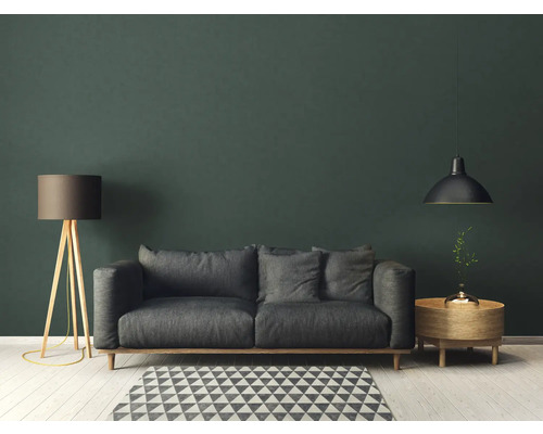 Wohnzimmer mit grauem Sofa, Stehlampe und Pendelleuchte