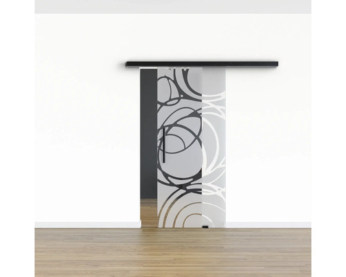 Schiebetür aus Glas mit Kreismuster vor einer weißen Wand