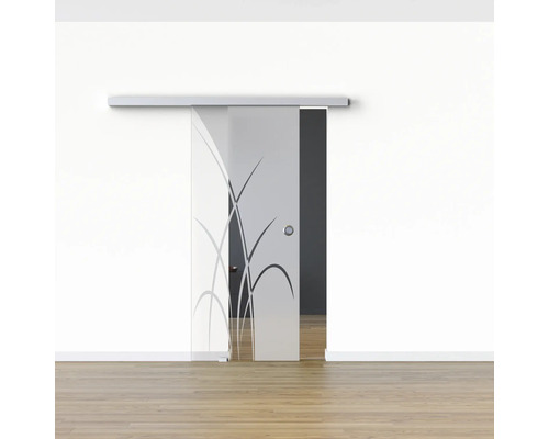 Porte coulissante en verre avec motif floral dans une pièce lumineuse