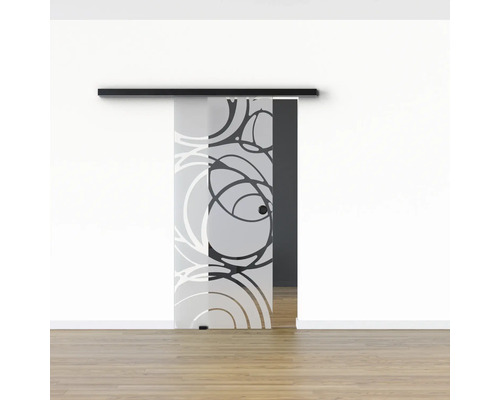 Schiebetür aus Glas mit Kreismuster vor weisser Wand