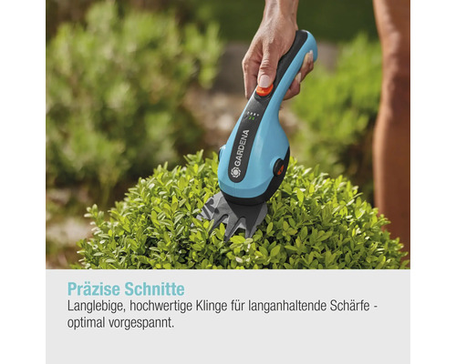 Gardena Akku Strauchschere im Einsatz zum Schneiden einer Pflanze