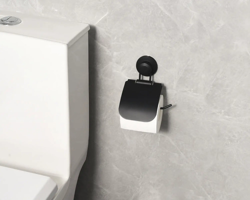 Porte-papier toilette à ventouse à côté des toilettes