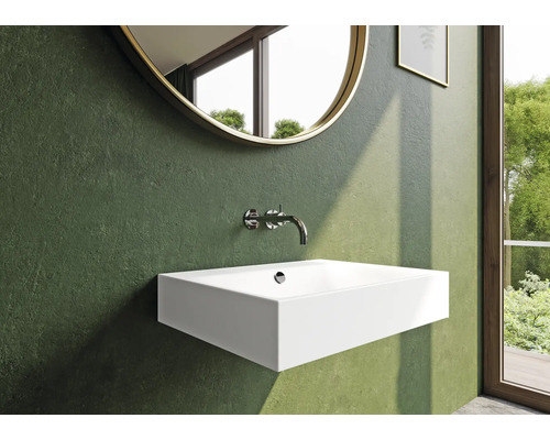 Modernes Badezimmer mit rechteckigem Waschbecken, Armatur und rundem Spiegel